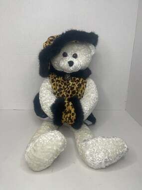 Chantilly Lane PBC Animated Singing White Teddy Bear in Leopard Print Outfit